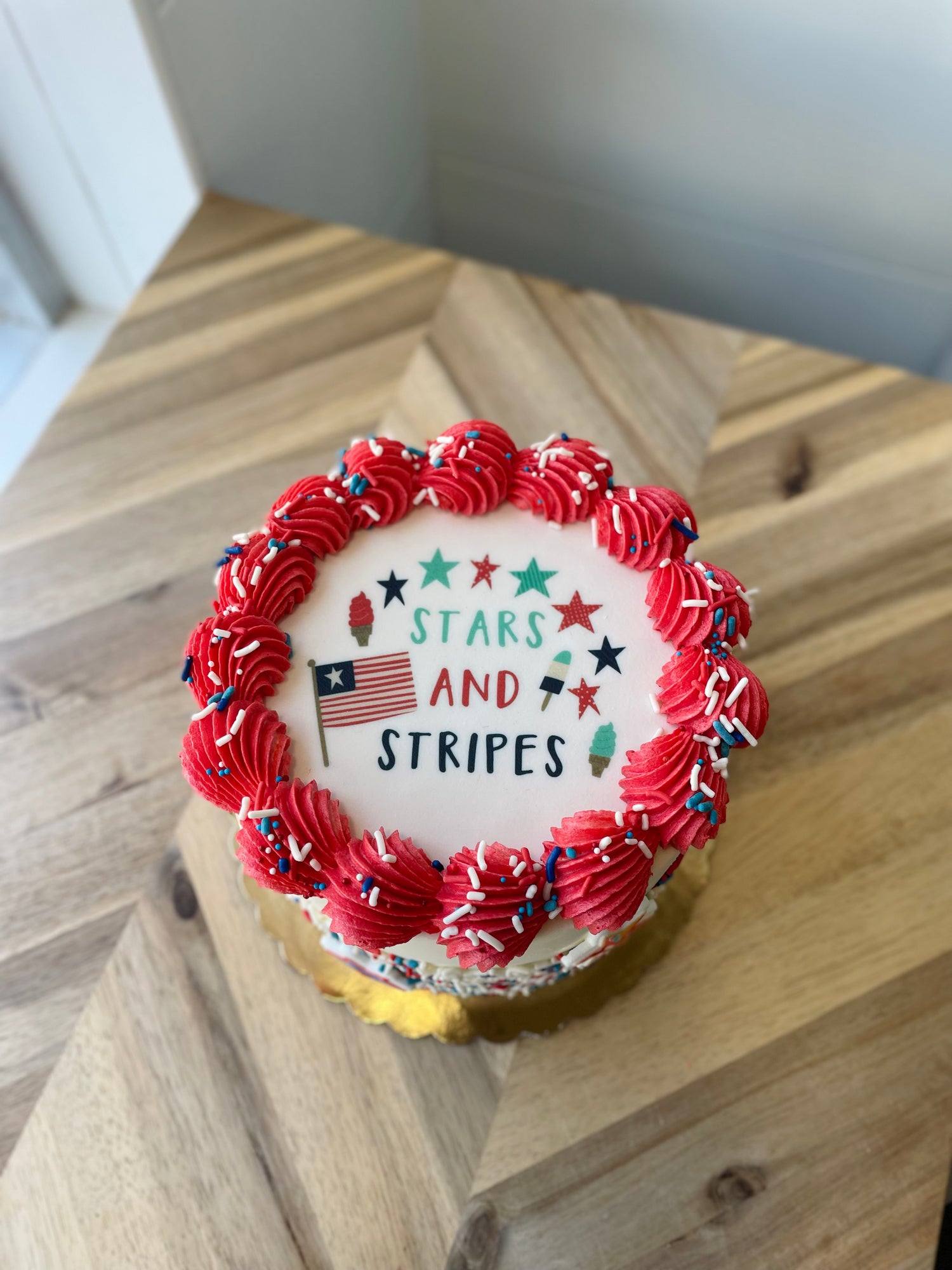 Small round cake with red frosting and &